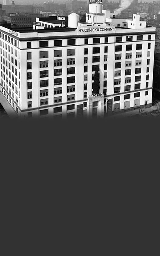 Black-and-white photo of a historic McCormick & Company building.